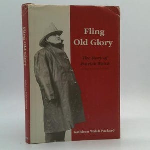 May include: A vintage book titled "Fling Old Glory" with a red and white cover. The cover features a black and white image of a person in a hat and coat. The book's title and author's name are printed on the cover.