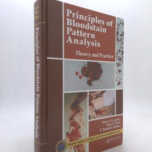 May include: A hardcover book titled "Principles of Bloodstain Pattern Analysis" with a brown cover and red and white text. The book includes the subtitle "Theory and Practice" and features images of bloodstains.