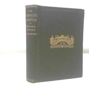 May include: A dark green hardcover book titled "The Parallel Gospels and Reference Passages." The book has gold lettering and a decorative emblem on the cover. The edges of the book are worn.