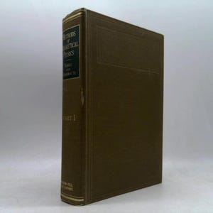 May include: A brown hardcover book titled Methods of Theoretical Physics Part I by Morse and Feshbach. The spine features gold lettering on a black background, and the cover has a textured finish with embossed border lines along the edges.
