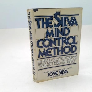 May include: A hardcover book titled "The Silva Mind Control Method." The cover is off-white with blue text. The title is in large, bold letters. The book's spine also has text. The book is about a revolutionary program.