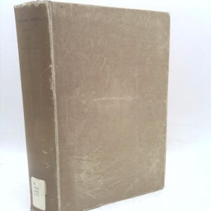 May include: A vintage, hardcover book with a worn, tan cover. The spine shows the title and volume number. A small white label with text is affixed to the bottom of the spine. The book is set against a white background.