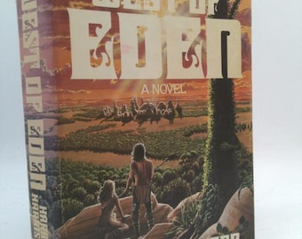 May include: A paperback book cover with a sunset background and two figures standing on a cliff. The book title is "West of Eden" by Harry Harrison.