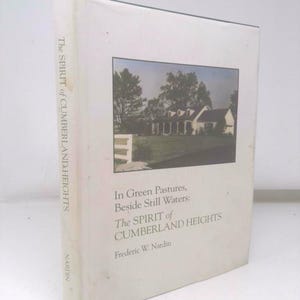 May include: A hardcover book titled "The Spirit of Cumberland Heights" by Frederic W. Nardin. The cover features a photograph of a white house with a green lawn and trees. The book's spine reads "The Spirit of Cumberland Heights" and the publisher is Nardin.