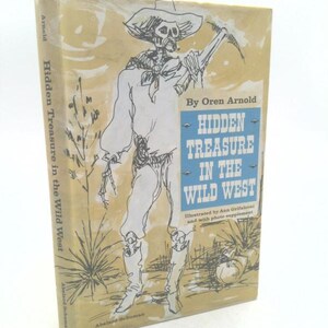 May include: A vintage book cover with a yellow background and a black and white illustration of a skeleton wearing a cowboy hat and holding a pickaxe. The book title is "Hidden Treasure in the Wild West" by Oren Arnold.