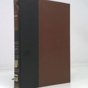 May include: A hardcover book with a brown cover and a black spine. The spine features the text "Great Books" and the number "17". The book has a classic, scholarly appearance.