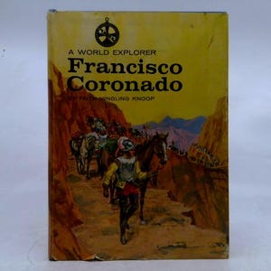 May include: A World Explorer book titled "Francisco Coronado" by Faith Yingling Knoop. The cover features an illustration of a man on horseback leading a group through a canyon. The book has a yellow background with the title in large, bold letters.