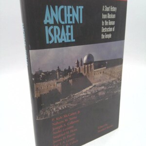 May include: A black book titled "Ancient Israel: A Short History from Abraham to the Roman Destruction of the Temple". The book cover features a photograph of the Western Wall in Jerusalem.