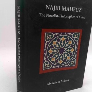 May include: A hardcover book titled "NAJIB MAHFUZ The Novelist-Philosopher of Cairo" by Menahem Milson. The book has a black cover with a decorative square design in red, purple, yellow, and white. The book's spine also displays the author's name and title.