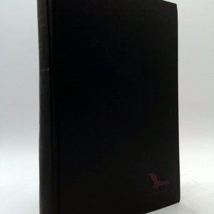 May include: A black hardcover book with a bat silhouette on the front cover.