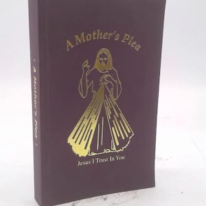May include: A burgundy book titled "A Mother's Plea" with gold lettering and an illustration of a religious figure. The text "Jesus I Trust In You" is below the illustration. The book's spine also has the title.