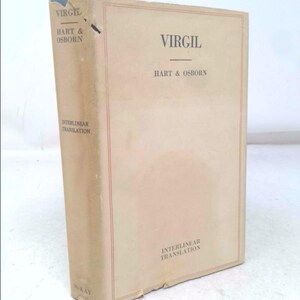 May include: A cream-colored book with the title "VIRGIL" by "HART & OSBORN" printed on the front cover. The book is an interlinear translation.