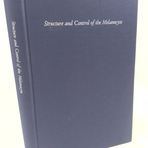 May include: A navy blue hardcover book with the title "Structure and Control of the Melanocyte" printed in white on the front cover.