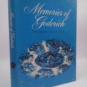May include: A vintage book titled "Memories of Goderich" with a blue cover. The cover features an illustration of a town and the text "The Prettiest Town in Canada". The book's spine also displays the title.