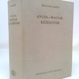 May include: A white book with the title "Angol-Magyar Kéziszótár" by László Országh. The book is published by Akadémiai Kiadó, Budapest.