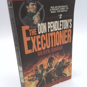 May include: The Don Pendleton's Executioner #2: Death Squad paperback book cover features a man holding a gun in front of a fiery background. The text on the cover reads "Bolan recruits a private army to maul the mafia! #2 The Don Pendleton's Executioner Death Squad".