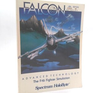 May include: A vintage computer game box for "Falcon A.T." featuring an illustration of an F-16 fighter jet soaring over a mountainous landscape. The box has the text "Advanced Technology" and "The F-16 Fighter Simulation". The Spectrum HoloByte logo is also visible.