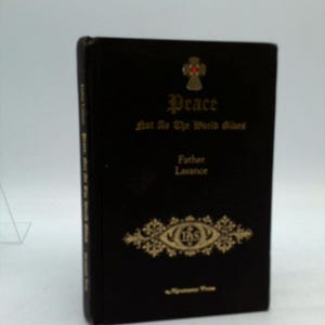 May include: A black book with gold lettering and decorative elements. The title "Peace" is displayed prominently, along with the text "Not As The World Gives" and the author's name, "Father Lasance". A cross and other symbols are also visible.