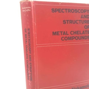May include: A red book titled "Spectroscopy and Structure of Metal Chelate Compounds." The book's spine displays the title vertically. The author's name, Nakamoto McCarthy, is visible on the spine and cover. The book is in good condition.