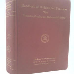 May include: A maroon hardcover book titled "Handbook of Mathematical Functions" with gold lettering. The book includes formulas, graphs, and mathematical tables. The U.S. Department of Commerce and National Bureau of Standards are also listed.