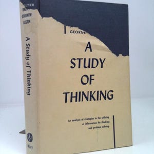 May include: A vintage book titled "A Study of Thinking" by George, with a beige cover and black spine. The cover has the title in large, bold letters, and the spine reads "A Study of Thinking". The book is published by Wiley.