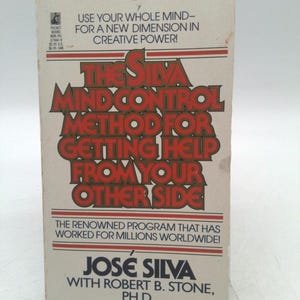 May include: A vintage paperback book titled "The Silva Mind Control Method for Getting Help from Your Other Side." The cover features red and white text on a cream background. The book promises a new dimension in creative power.