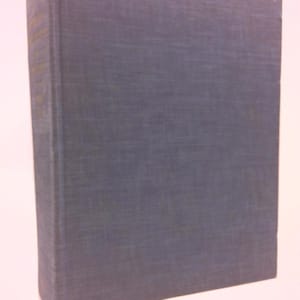 May include: A dark blue hardcover book with a textured cover.