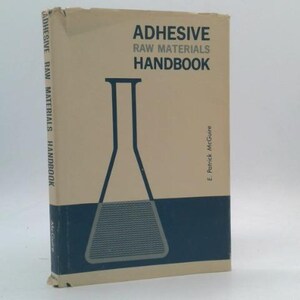 May include: A hardcover book titled "ADHESIVE RAW MATERIALS HANDBOOK" with a beige cover and a blue and black graphic of a laboratory flask. The book's spine also displays the title. The author's name, E. Patrick McGuire, is printed on the cover.