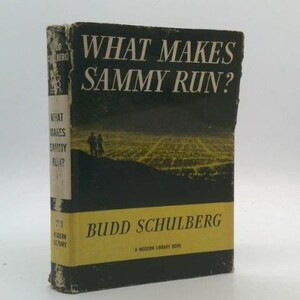 May include: Vintage hardcover book titled "What Makes Sammy Run?" by Budd Schulberg. The cover is black with yellow text and a landscape illustration. The book is a Modern Library Book.