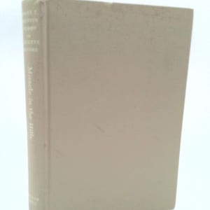 May include: A beige hardcover book with the title "The Complete Writings of Henry D. Thoreau" and the subtitle "Middle  to the Wild" printed on the spine.
