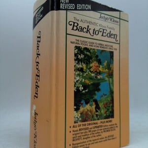 May include: A vintage copy of "Back to Eden" by Jethro Kloss. The book has a tan cover with the title in a decorative font. The cover features an illustration of a garden scene. The spine reads "Back to Eden" and "Jethro Kloss". The book is a revised edition.