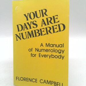 May include: A yellow book titled "YOUR DAYS ARE NUMBERED" in black stencil font. The book is a manual of numerology for everybody by Florence Campbell.