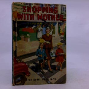 May include: Vintage children's book titled "Shopping With Mother." The cover illustration depicts a woman and two children crossing a street, with a red car in the foreground. The book's title is in large, red letters.