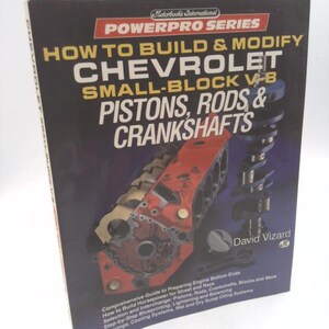 May include: A book cover with a red, white, and blue color scheme. The title is "How to Build & Modify Chevrolet Small-Block V-8 Pistons, Rods & Crankshafts". The cover features a close-up image of a Chevrolet engine.