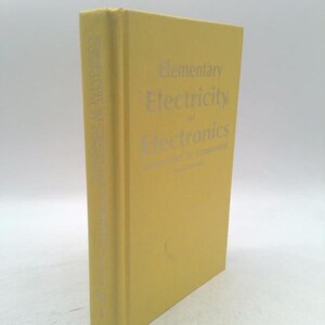 May include: A yellow book titled "Elementary Electricity of Electronics" with silver lettering. The book is standing upright, with the spine visible, which also has text. The book is in good condition.