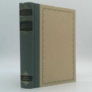 May include: A hardcover book with a teal spine and tan cover. The spine features the author's name, book title, and "Folio Society" in gold lettering. The cover has a decorative border.