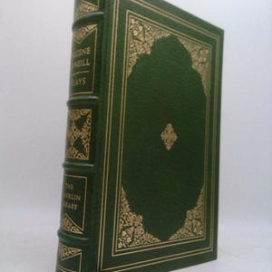 May include: A green leather-bound book with gold accents and the text "Eugene O'Neill Plays" and "The Franklin Library" on the spine.