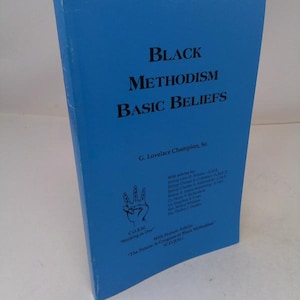 May include: A white ceramic mug with a black handle and the text "But First, Coffee" in a black, bold font. The mug is on a white surface. The mug is approximately 4 inches tall.