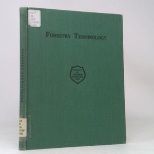 May include: A green hardcover book titled "Forestry Terminology." The book has a dark green cover with the title in black letters. The Society of American Foresters logo is centered on the cover. A white label is affixed to the spine.