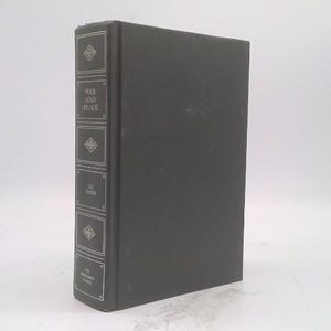May include: A hardcover book titled "War and Peace" by Leo Tolstoy. The book has a dark gray cover with the title and author's name in white lettering on the spine. Decorative diamond-shaped patterns are also present.