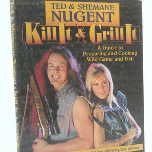 May include: A cookbook titled "Kill It & Grill It" by Ted & Shemane Nugent. The cover features a man and woman, both smiling, with the man holding a rifle. The book's subtitle is "A Guide to Preparing and Cooking Wild Game and Fish."