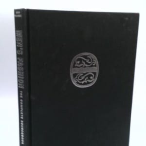 May include: A black hardcover book titled "Men's Fashion: The Complete Sourcebook." The book has a silver emblem on the front cover. The spine of the book displays the title vertically.