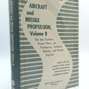 May include: A vintage book titled "Aircraft and Missile Propulsion, Volume II" by M. J. Zucrow. The cover is off-white with green stripes and text. The book discusses gas turbine power plants, turboprops, turbojets, ramjets, and rocket engines.