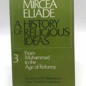 May include: A green book titled "A History of Religious Ideas" by Mircea Eliade, volume 3, "From Muhammad to the Age of Reforms".