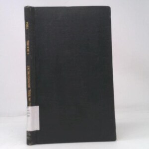 May include: A hardcover book with a black cover. The spine features gold lettering and the title "Soil Management". A white label is affixed near the bottom. The book is set against a white background.