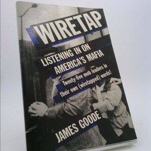 May include: A book cover with a black and white photo of a man in a suit. The title of the book is "Wiretap: Listening in on America's Mafia". The subtitle is "Twenty-five mob leaders in their own (wiretapped) words!" The author's name is "James Goode".