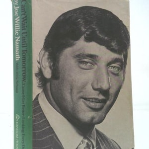 May include: A vintage book cover featuring a black and white portrait of a man in a suit. The book's title, "Can't Wait Until Tomorrow," is visible on the spine. The author's name, Joe Willie Namath, is also displayed.