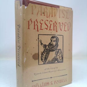 May include: A book titled "Paradise Preserved" with a drawing of a man in a hat and a ruff collar on the cover. The book is a history of the Roanoke Island Historical Association by William S. Powell.