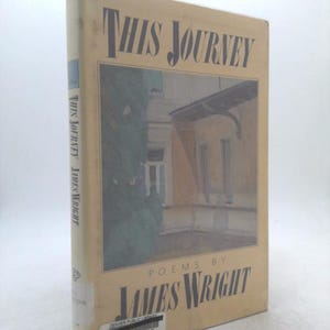 May include: A hardcover book titled "This Journey" by James Wright. The cover features a muted illustration of a building and foliage. The book's spine displays the title and author's name. A library sticker is affixed to the bottom.