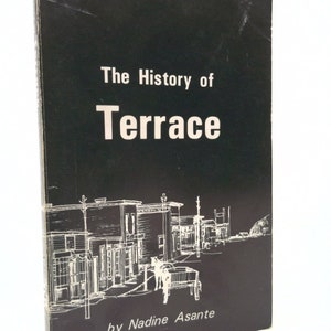 May include: Black and white cover of a book titled "The History of Terrace" by Nadine Asante. The cover features a simple line drawing of a street scene with buildings and a horse-drawn carriage.